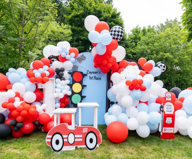 First birthday party with red, white, and black balloons